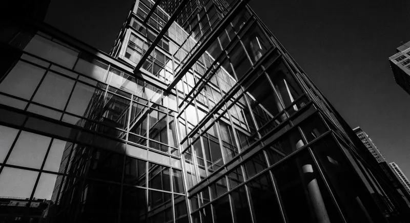 Glass curtain-wall tower rising in black and white over Back Bay